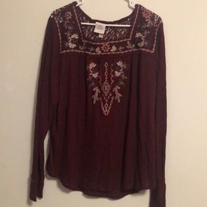 Maroon top with subtle details